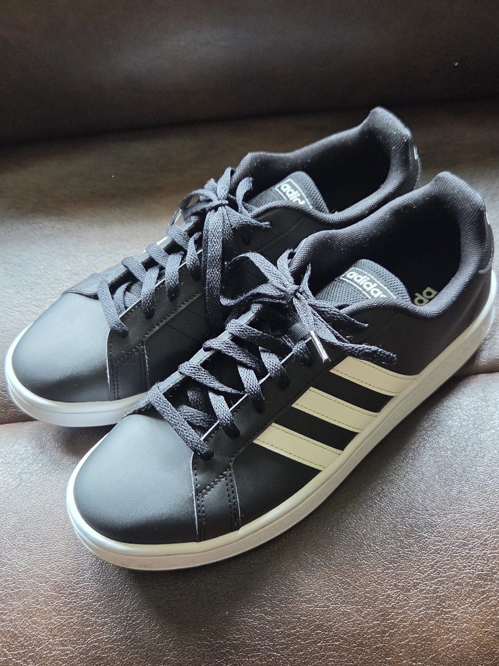 Adidas Men’s Black Sneaker with White Stripes